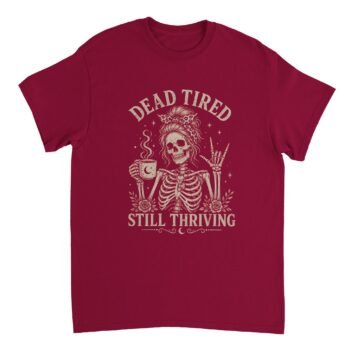 Dead Tired Shirt design featuring a skeleton holding coffee and making a rock-on hand sign with "Dead Tired, Still Thriving" text